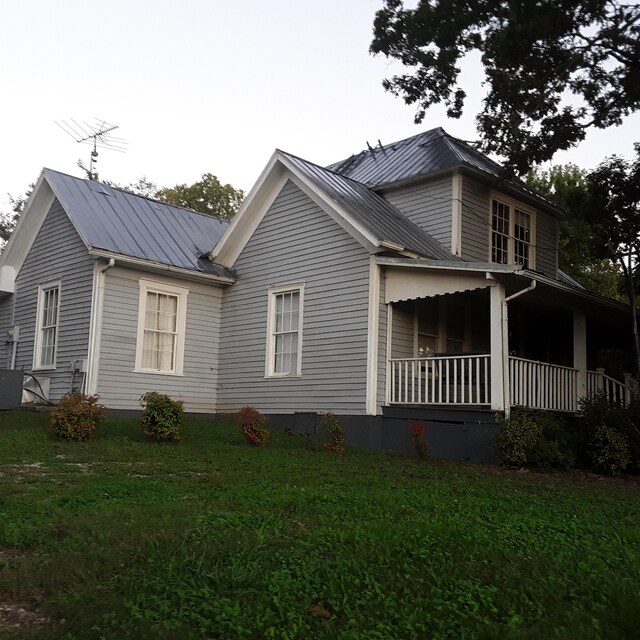 059/057.00 Spring Creek Rd, Dandridge, TN 37725 - view of side of property featuring a yard, metal roof, and a porch