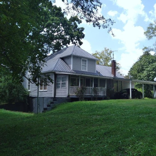 059/057.00 Spring Creek Rd, Dandridge, TN 37725 - rear view of property with a porch, metal roof, a lawn, and a chimney