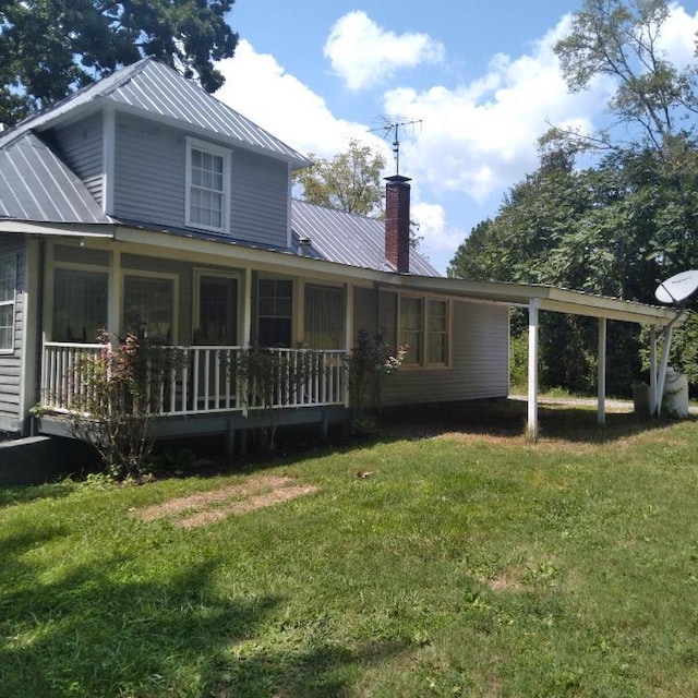 059/057.00 Spring Creek Rd, Dandridge, TN 37725 - rear view of property with a yard, metal roof, and a chimney
