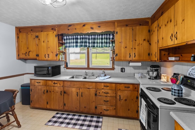 305 Hamilton Pl, Kingsport, TN 37663 - kitchen featuring black microwave, white electric range, light countertops, and a textured ceiling