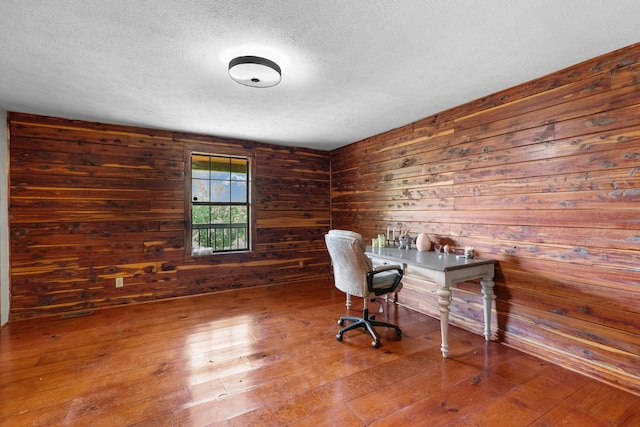 148 Delph Ln, Mooresburg, TN 37811 - home office with a textured ceiling, hardwood / wood-style flooring, and wooden walls