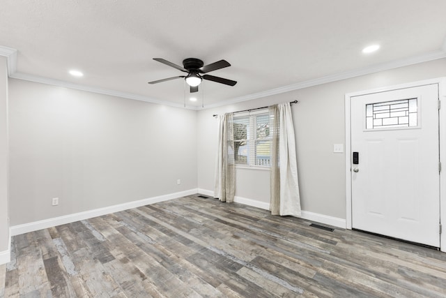 foyer entrance featuring wood-type flooring, ornamental molding, and ceiling fan