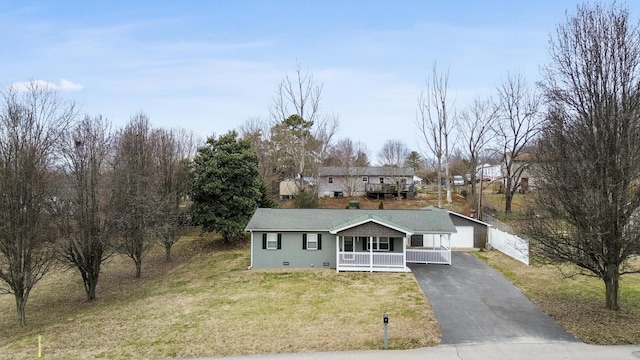 view of front of home with a porch and a front lawn