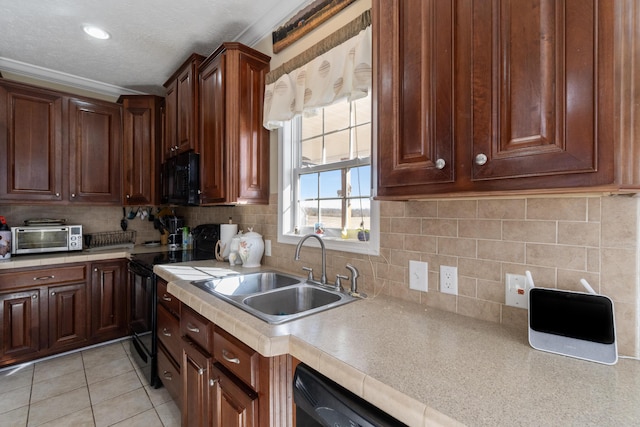 kitchen with decorative backsplash, ornamental molding, black appliances, sink, and light tile patterned floors