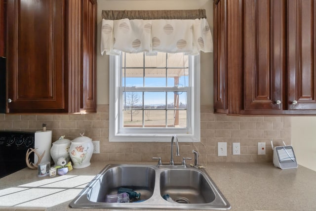 kitchen with decorative backsplash and sink