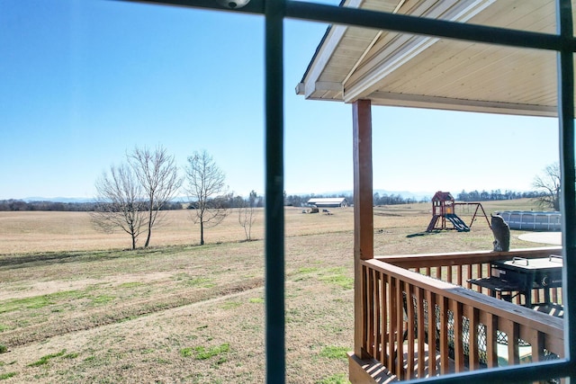 view of yard with a rural view and a playground