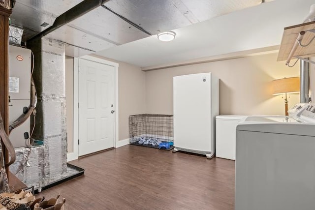 5700 Academy Dr, Morristown, TN 37814 - below grade area with washing machine and dryer and wood finished floors