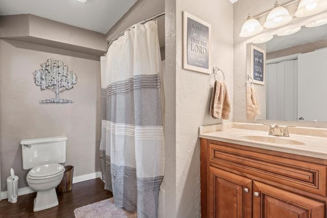 5700 Academy Dr, Morristown, TN 37814 - bathroom featuring wood finished floors, toilet, vanity, baseboards, and a shower with shower curtain
