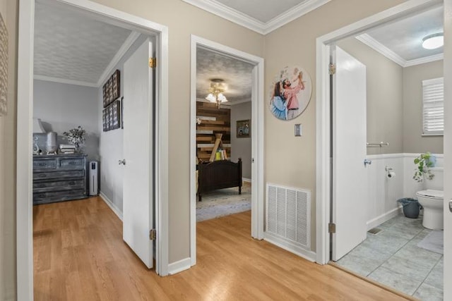 5700 Academy Dr, Morristown, TN 37814 - hall featuring light wood-style flooring, crown molding, and baseboards