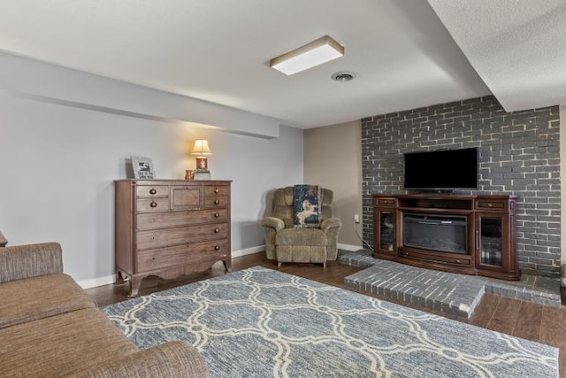 5700 Academy Dr, Morristown, TN 37814 - sitting room featuring wood finished floors, a glass covered fireplace, and baseboards