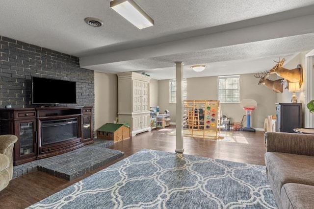 5700 Academy Dr, Morristown, TN 37814 - living area with baseboards, wood finished floors, a fireplace, and a textured ceiling
