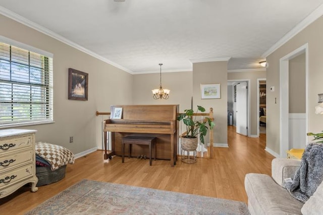 5700 Academy Dr, Morristown, TN 37814 - living area with light wood-style floors, ornamental molding, a chandelier, and baseboards