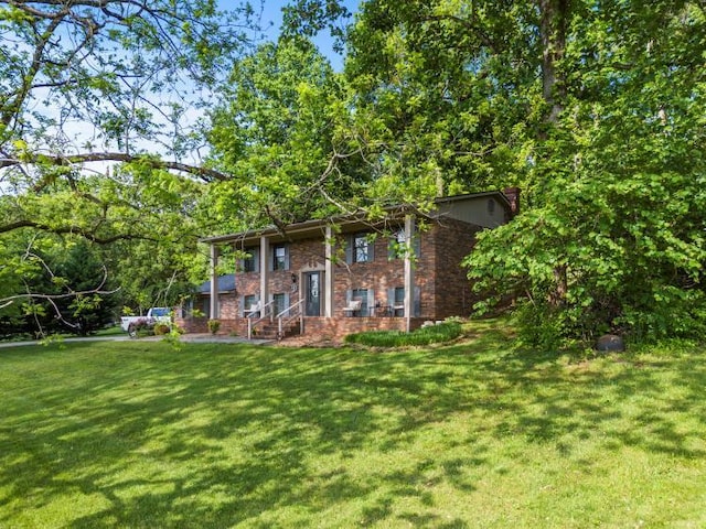 5700 Academy Dr, Morristown, TN 37814 - rear view of property featuring a lawn and brick siding
