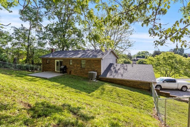 5700 Academy Dr, Morristown, TN 37814 - rear view of house featuring cooling unit, a patio area, and a chimney