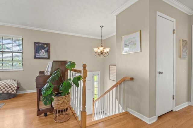 5700 Academy Dr, Morristown, TN 37814 - stairway featuring wood finished floors, baseboards, ornamental molding, and a chandelier