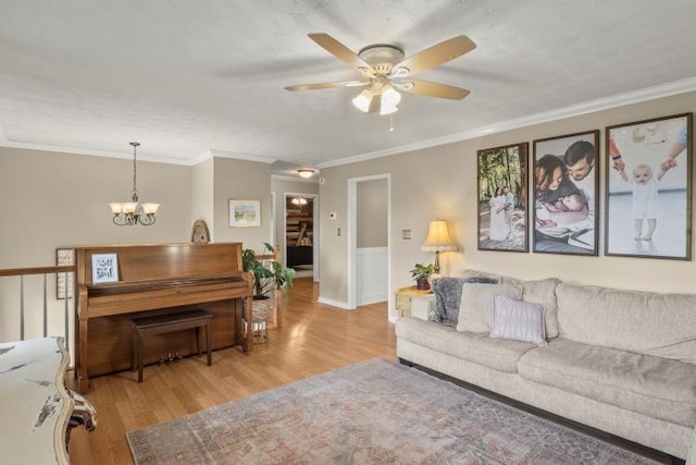 5700 Academy Dr, Morristown, TN 37814 - living area featuring a ceiling fan, light wood finished floors, a chandelier, and crown molding