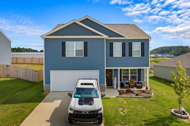 view of front facade with a garage and a front lawn