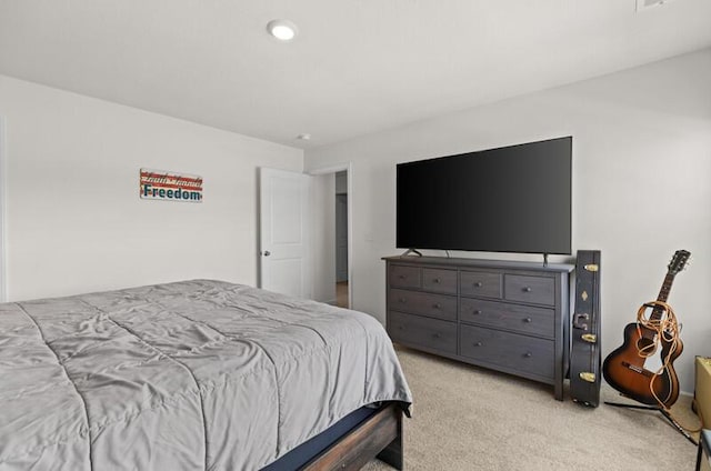 bedroom featuring light colored carpet