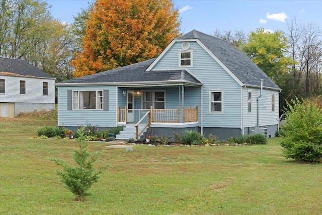 view of front of house featuring covered porch and a front yard