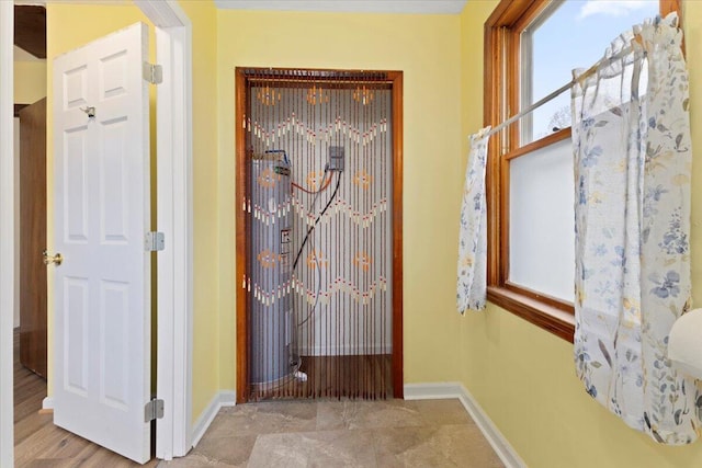 hallway with light hardwood / wood-style floors