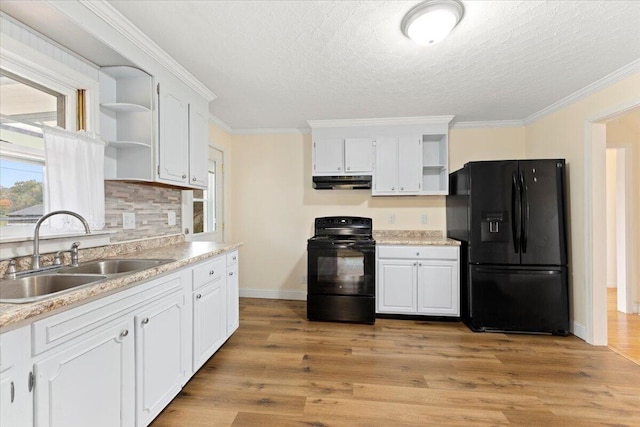 kitchen featuring sink, crown molding, white cabinets, black appliances, and light wood-type flooring