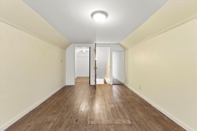 bonus room featuring dark hardwood / wood-style floors and vaulted ceiling