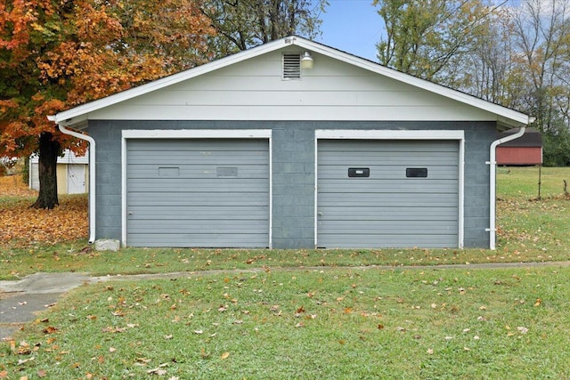 garage featuring a yard