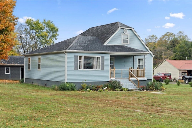 view of front of property with covered porch and a front yard