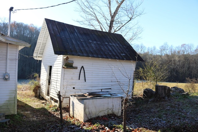 view of property exterior featuring an outbuilding