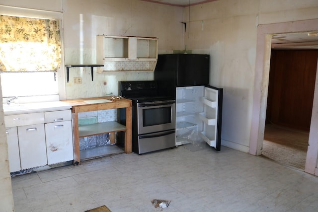 kitchen with white cabinetry and stainless steel range with electric cooktop