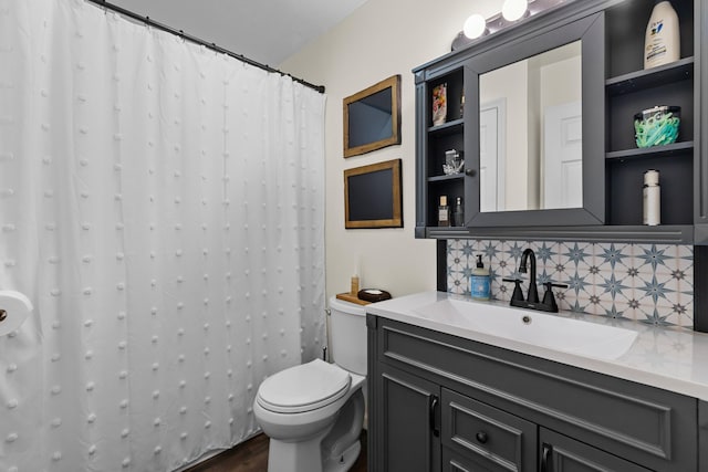 3912 Isaac Ave, Morristown, TN 37814 - full bathroom featuring decorative backsplash, vanity, toilet, wood finished floors, and a shower with curtain