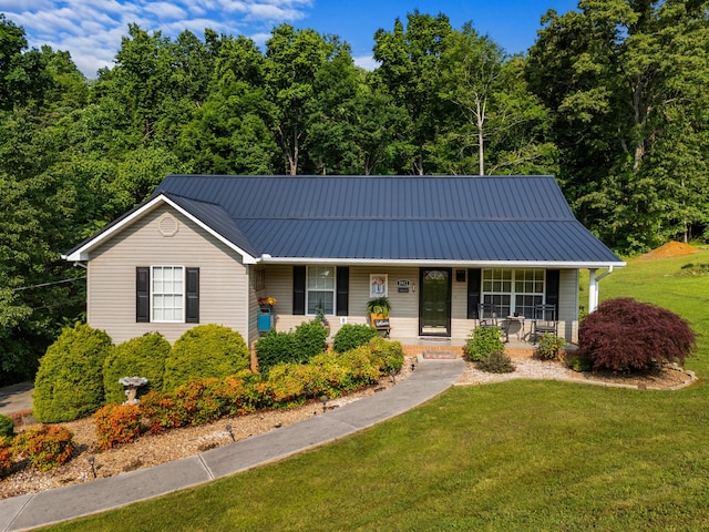 3912 Isaac Ave, Morristown, TN 37814 - view of front of house featuring a front yard, a porch, and metal roof