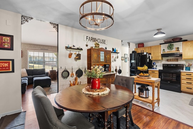 3912 Isaac Ave, Morristown, TN 37814 - dining room with a chandelier and light wood-style floors