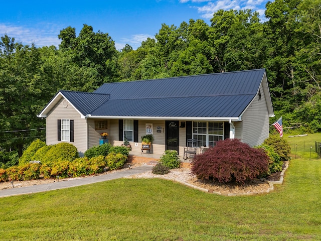 3912 Isaac Ave, Morristown, TN 37814 - ranch-style house featuring a front yard, covered porch, and metal roof