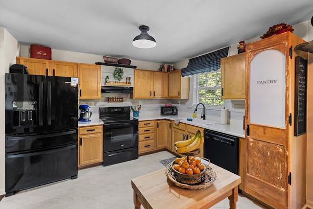 3912 Isaac Ave, Morristown, TN 37814 - kitchen with black appliances, extractor fan, light countertops, a sink, and tasteful backsplash