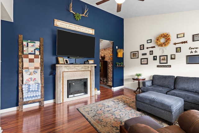 3912 Isaac Ave, Morristown, TN 37814 - living room featuring a ceiling fan, a glass covered fireplace, wood finished floors, and baseboards