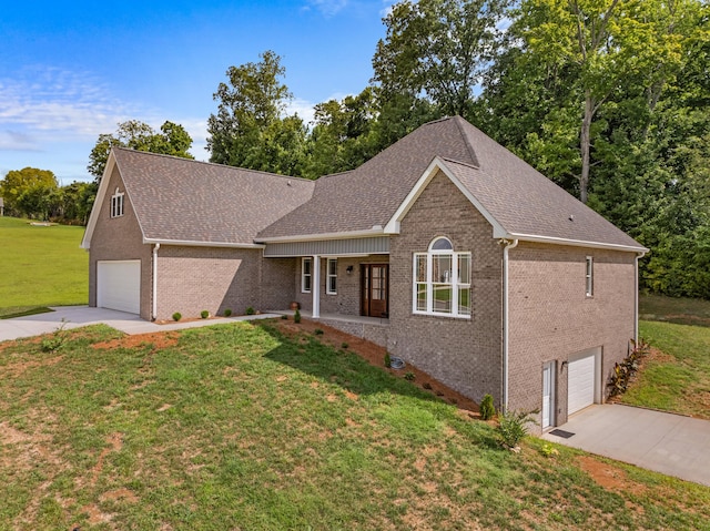 view of front of property with covered porch, a garage, and a front lawn