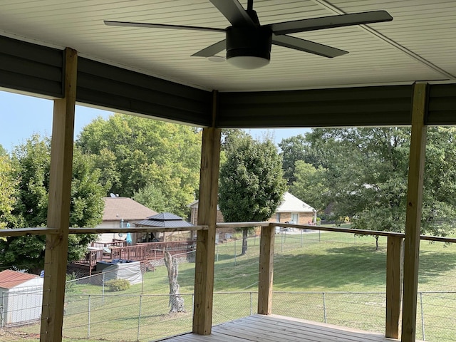 wooden deck with a yard, a gazebo, fence, and a ceiling fan