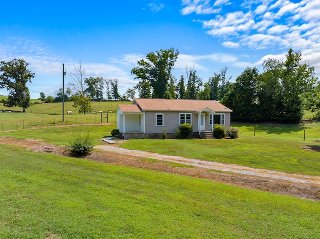 ranch-style home featuring a front lawn