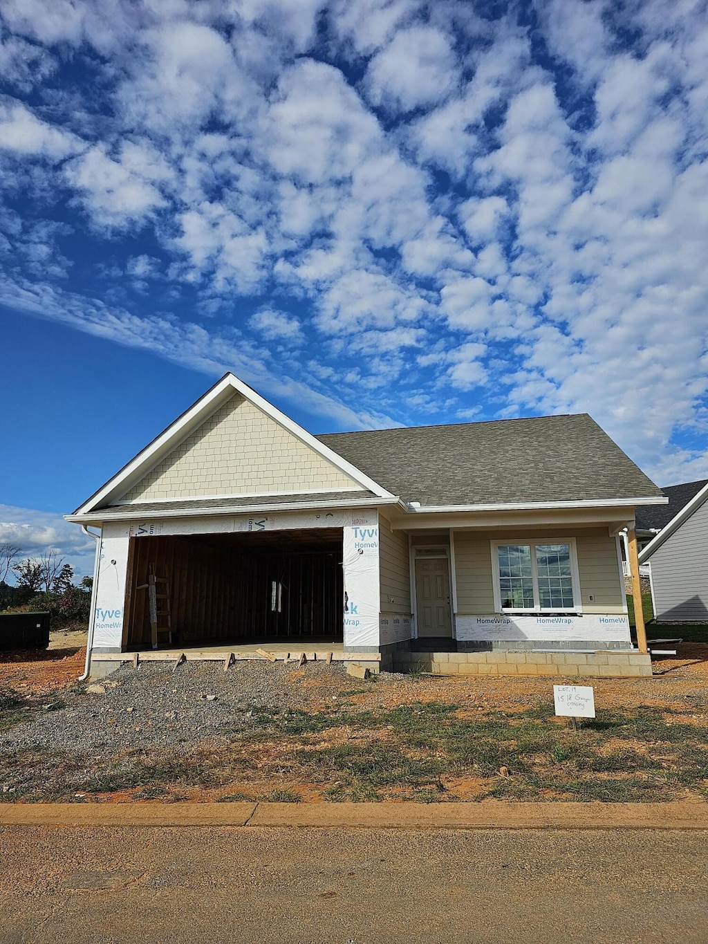 view of front of home featuring covered porch and a garage