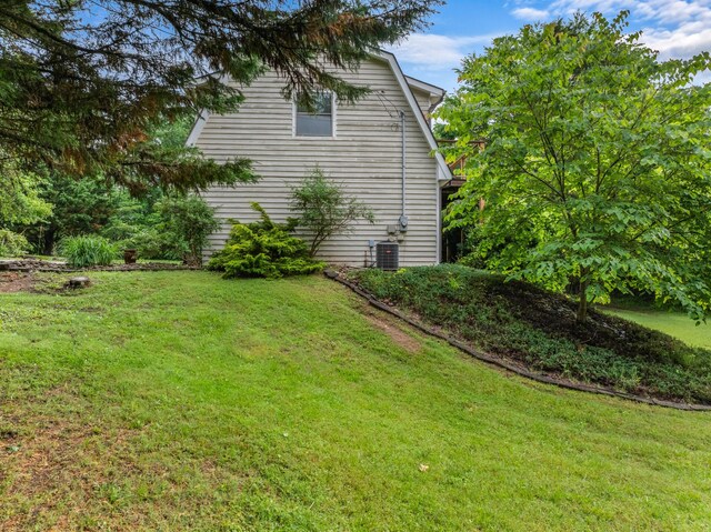 view of yard with central AC