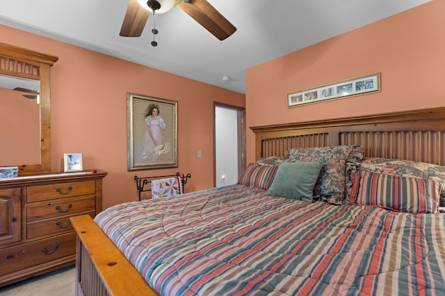 bedroom with ceiling fan and light carpet