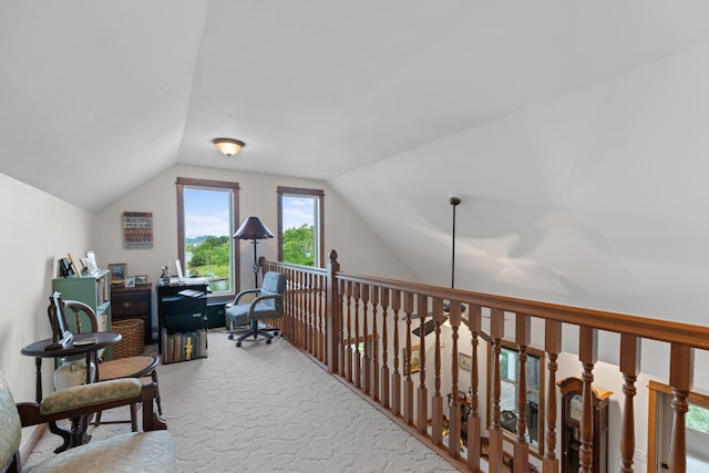 home office featuring vaulted ceiling and carpet flooring