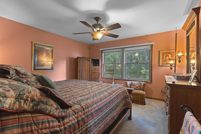 bedroom with a ceiling fan, carpet, and baseboards