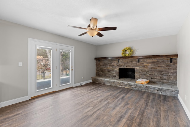 unfurnished living room with ceiling fan, dark hardwood / wood-style floors, and a fireplace