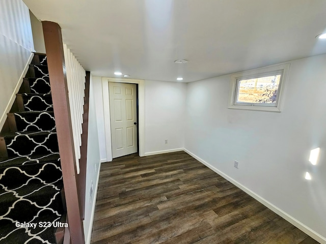 basement featuring dark hardwood / wood-style flooring