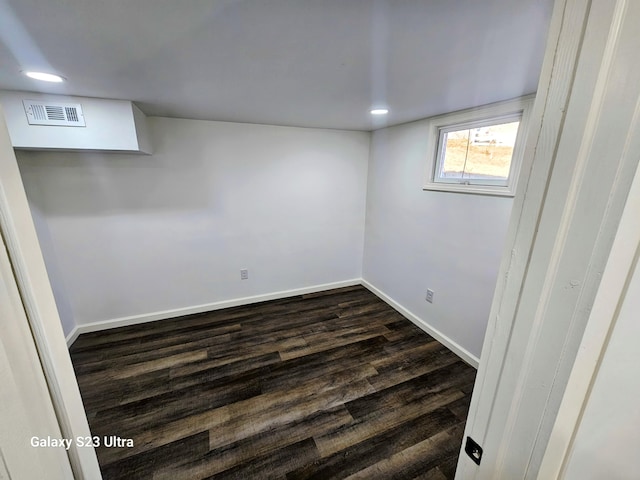 basement featuring dark wood-type flooring