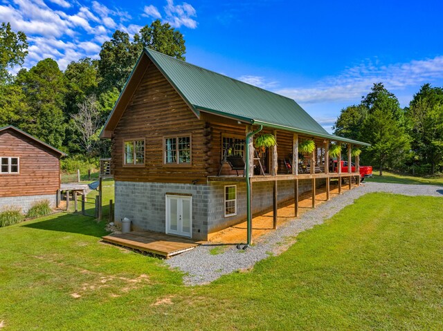 exterior space with a deck and a yard