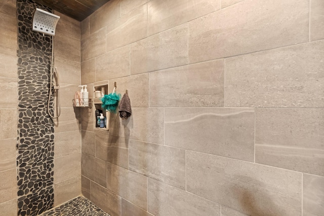 bathroom with tiled shower