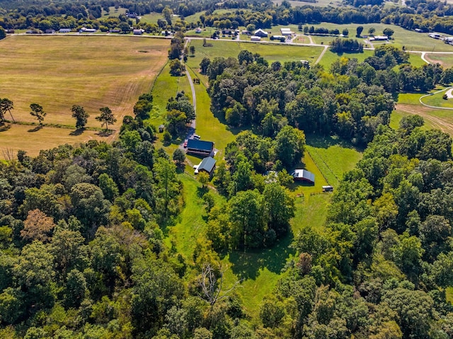 birds eye view of property with a rural view